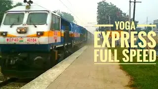 Honking EMD with Yoga Express at Full Speed