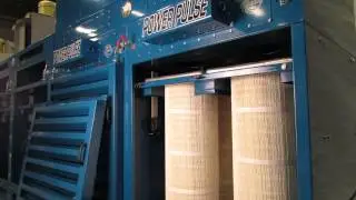 Linear track actuators in dust collector booth