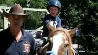 Ryan riding a horse at Rocking Horse Ranch