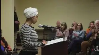 Ilhan Omar gets approached by a man and sprayed with some sort of liquid during a town hall