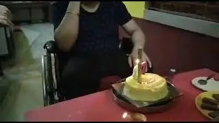 A Physically Challenged Man is Celebrating His Birthday.