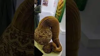 Guess What This Art Paper at World Art Dubai 2025: Folded Snake or Vase?