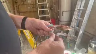 Wiring single LSF cables through a galvanised conduit.
