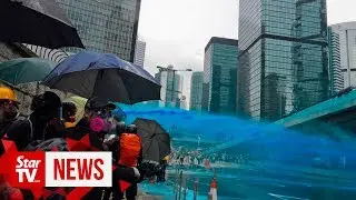 Barricade burnt as Hong Kong protest heats up