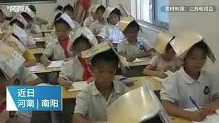 Primary school teacher in Nanyang places books on children's heads to correct sitting postures