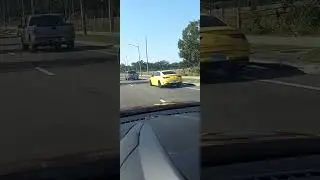 Very nice Yellow Mercedes zipping by