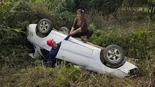 The girl rescued the overturned car, repaired and restored the car's engine.