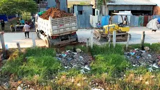 Skills Dump Truck Unloading At Prone To Accidents For Filling Land - Bulldozer Hard Work Pushing