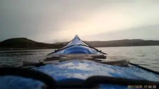 Neil and Ian kayaking round Rassay
