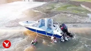 Dramatic moment boaters on dam rescued from edge of 130ft drop