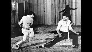 Bruce Lee Performs a Slow One-Arm Pull-Up &mdash;