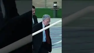 Ex Trump adviser John Bolton arrives at court to surrender