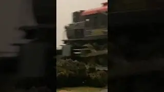 CPR #785 Runs past with a slow freight train