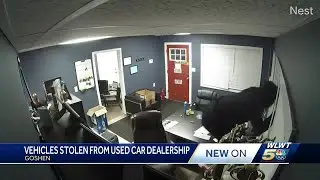 Brazen car theft caught on camera as thieves smash through dealership window to grab keys