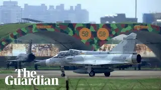 China sends dozens of warplanes and warships towards Taiwan