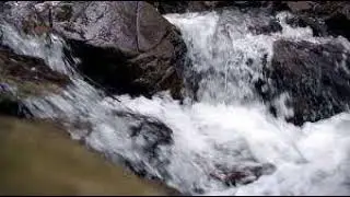 Multi-step waterfall, shallow trickle of water through rocks,  sound effect free for use