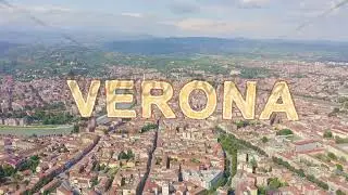 Inscription on video. Verona, Italy. Flying over the historic city center. Arena di Verona, summer.