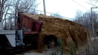 C&NW side dump car being dumped at IRM
