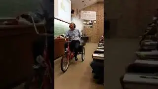 Former Univ. of Iowa Pres. Bruce Harreld rides a rocket-powered tricycle!