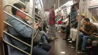 Homeless man gets kicked off F train by NYPD.