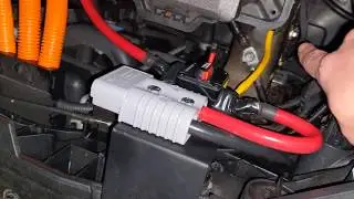 Hyundai Kona EV with 1000W inverter powering a vacuum cleaner