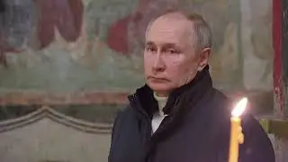 Putin attends Orthodox Christmas service alone