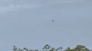 Private Aerospatiale AS350 [G-KLNM] flying above