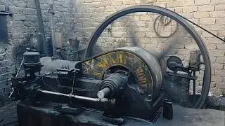 Old black desi diesel engine Pakistani technology working with machine aata chaki in Punjab
