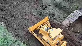 Friends testing out the dozer.