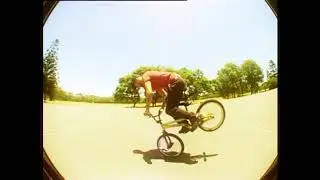 Simon O'Brien holds a long nose wheelie at Windsor Park