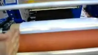 Pre-stretched film edge folding oscillating rewinding machine