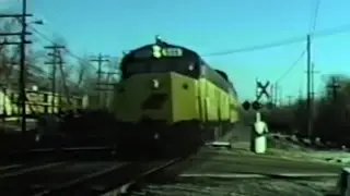 Chicago & Northwestern (C&NW) Commuter Train with Crandall Cab Locomotive  in Wheaton, IL 1979