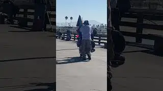 Fisherman with fishing cart leaving the Pier
