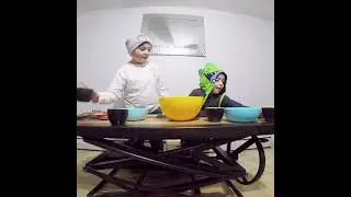 Leo and Dylan baking chocolate chip cookies