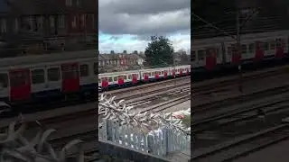 District Line Train Arriving at East Ham Station