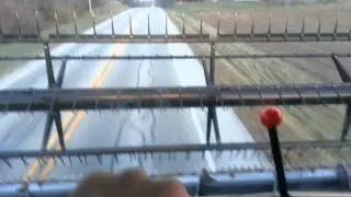 Driving combine down busy road