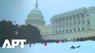 Snowstorm Turns Capitol Hill Into Winter Wonderland | Kids Sled Outside US Capitol | APT