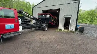 Loading Switchngo 14&rsquo; dumpster from inside garage