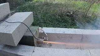 Estes D12-0 rocket engine fired in stationary position on ground - filmed in 1080p120fps