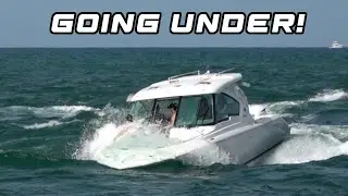 Boat takes in water from wave :0