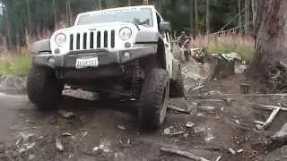 Scott cruises over Ron's Run log obstacle
