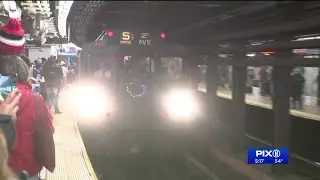 Subway riders take a `trip to the past` on vintage train