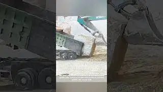 Heavyweight Teamwork: The Perfect Dance Between Excavator & Truck for Massive Stone Loading!