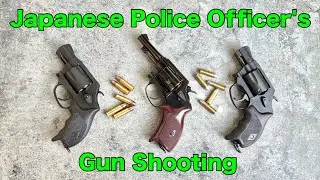 Japanese police officer shooting an airsoft model gun
