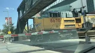 UP 5762 leads a light move along with an inbound train switching at the UP bridge and 4th Street