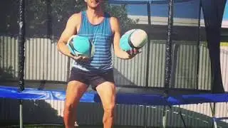 Juggling rugby balls with a bottle on my head standing on a swiss ball...