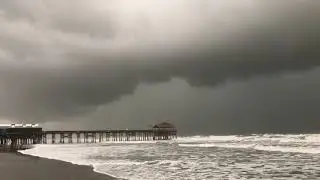 INTENSE SQUALL, developing water spout over Cocoa Beach Pier, FL!
