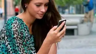Girl typing on a mobile phone