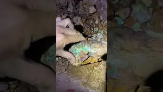 Rough Koroit opal down in a tunnel at The Comet opal mine