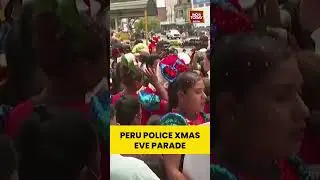 Peru's National Police drive the streets of Lima in costume for Christmas Eve parade